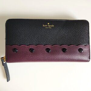 KATE SPADE NEW YORK PUBBLED BLACK AND PURPLE COW LEATHER ZIP AROUND WALLET
